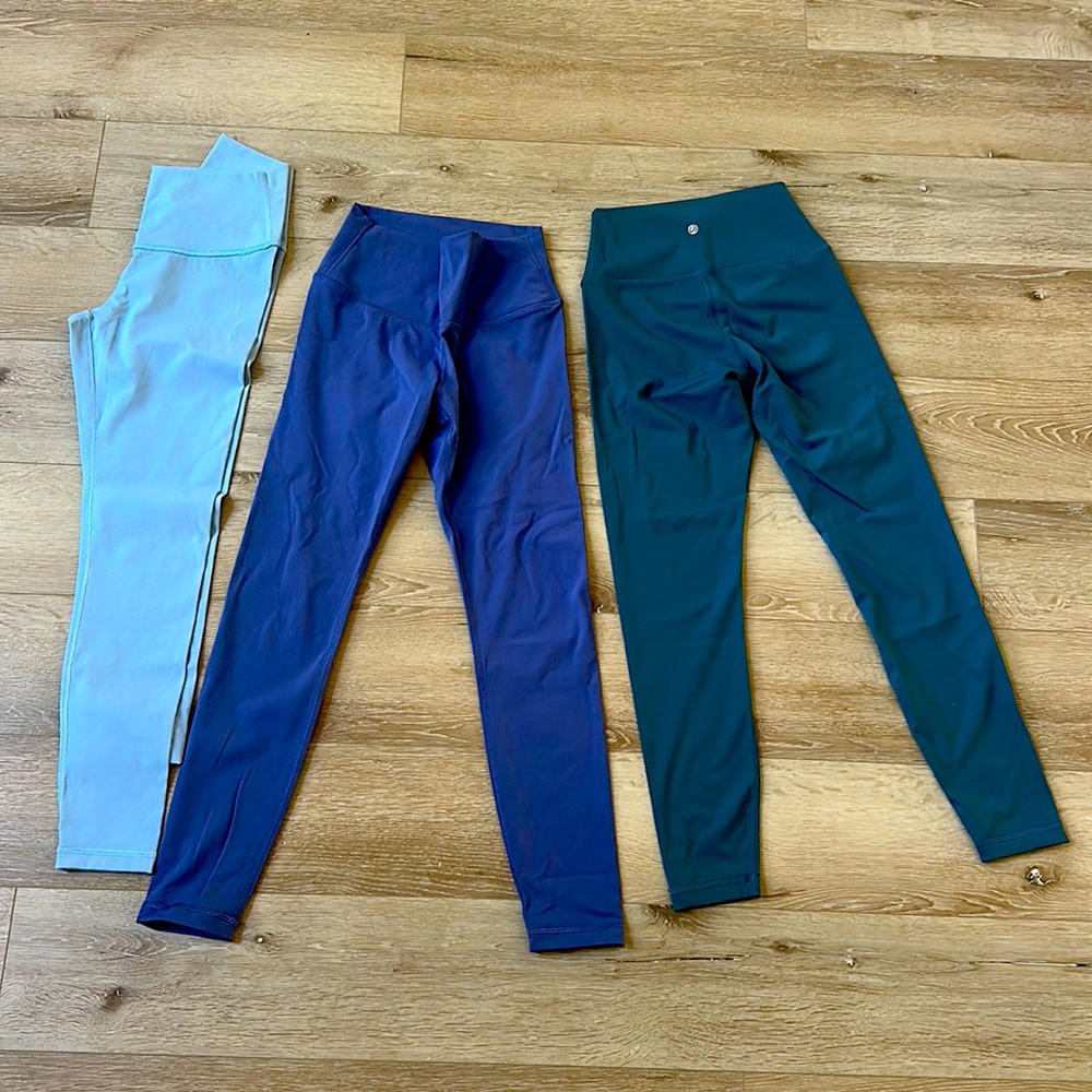 Bundle of 3 pair of Amazon leggings  light blue, purple, and dark teal size s/xs